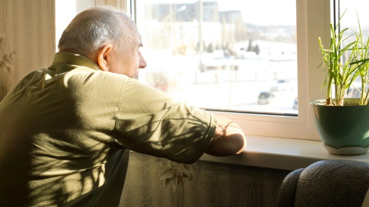 021215_ManLookingOutWindow