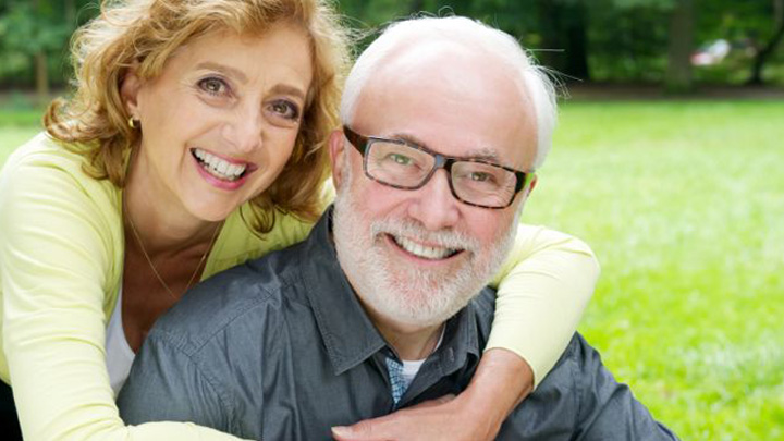 Happy-retired-senior-couple-smiling-in-the-park