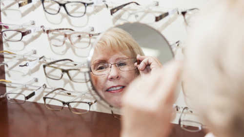 Woman trying on eyeglasses