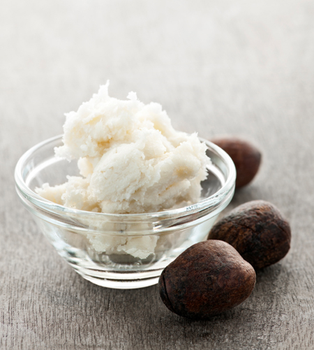 Shea butter and nuts in bowl