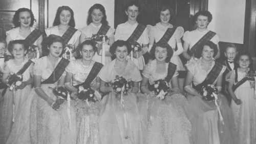 StateLibQld_1_296739_Debutantes_holding_bouquets_at_a_social_dance,_1952