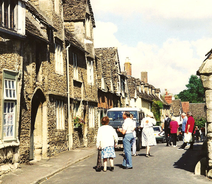 Tourists admiring some Lacock cottages.