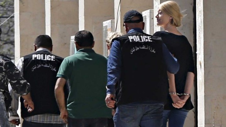 Tara Brown left the court handcuffed after the case was adjourned. (Reuters: Mohamed Azakir)