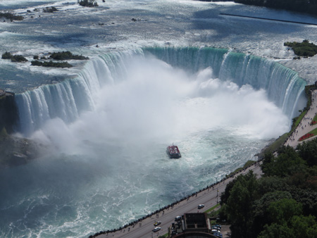 Aerial_view_of_the_Canadian_Falls_(Horseshoe_Falls)_and_the_Hornblower_Niagara_Cruises_boat;_Niagara_Falls