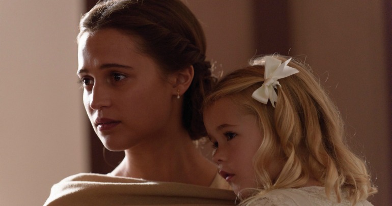 Isabel (Alicia Vikander) and Lucy-Grace (Florence Clery) in a scene from The Light Between Oceans.