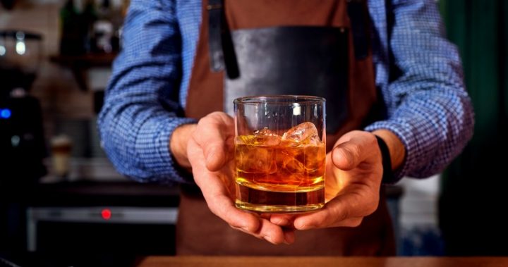 bartender-handing-scotch-whiskey