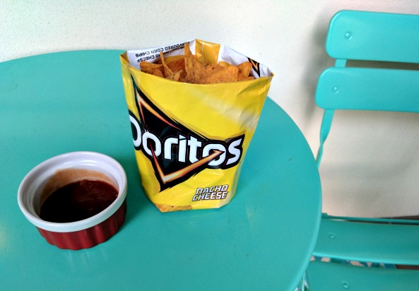 An easy way to present chips at a backyard BBQ is to utilise the packet as a bowl. 