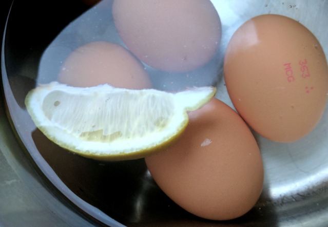 A slice of lemon in the pot while boiling eggs will make all the difference when it comes to peeling off the shell