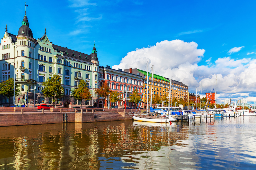 Scenic summer view of the Old Port pier architecture with ships, yachts and other boats in the Old Town of Helsinki, Finland