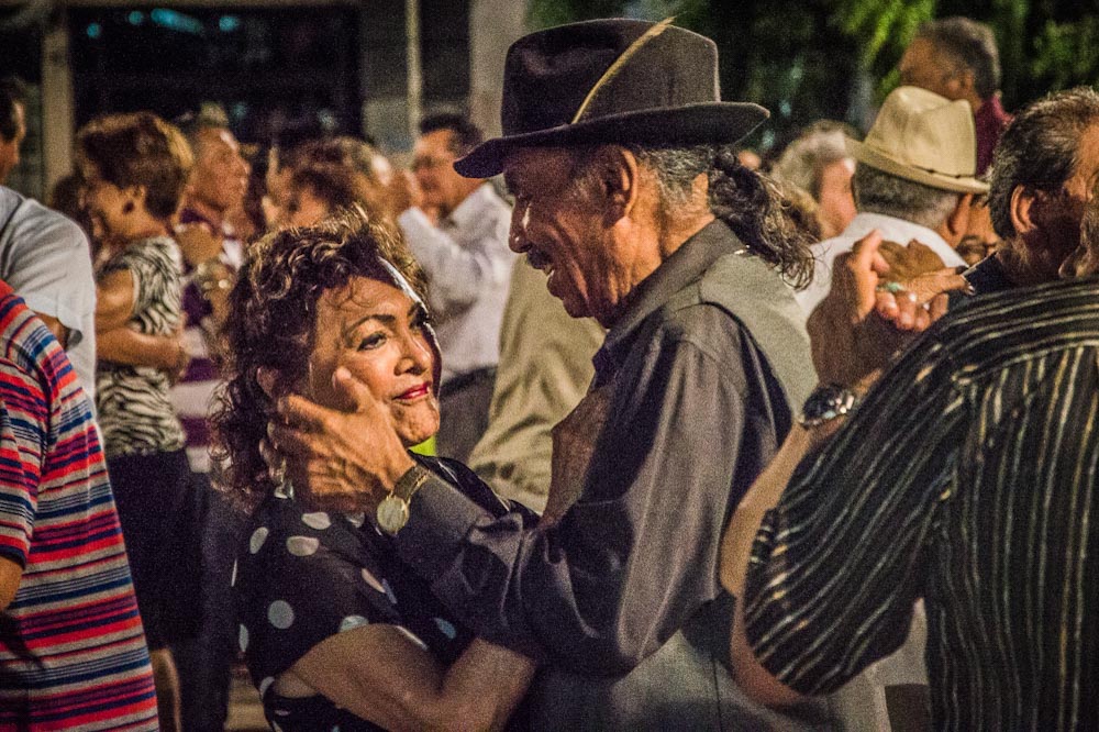 A couple enjoys the moment, dancing in the squares in Merida