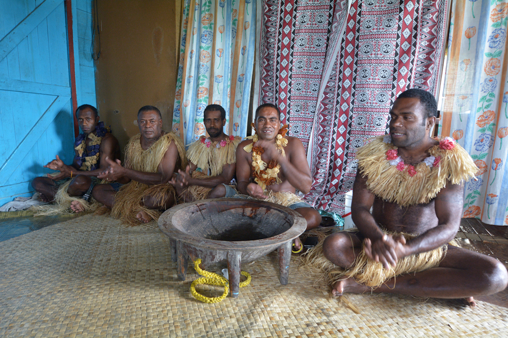 Fijian men participating in a kava ceremony