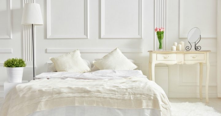 bedroom-170520 White double bed with plants on side tables.