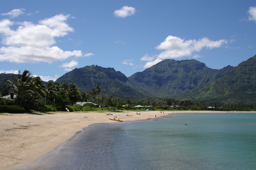 Lush mountains provide a beautiful backdrop to the postcard-worthy beaches