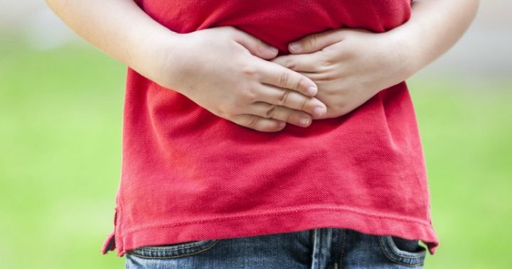 child-stomach-ache child holding sore stomach