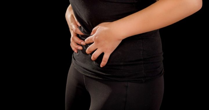 woman body hands stomach uti women holding hands over stomach