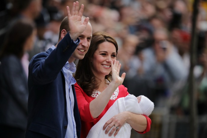 William and Catherine wave to well-wishers as they present their new son to the world.