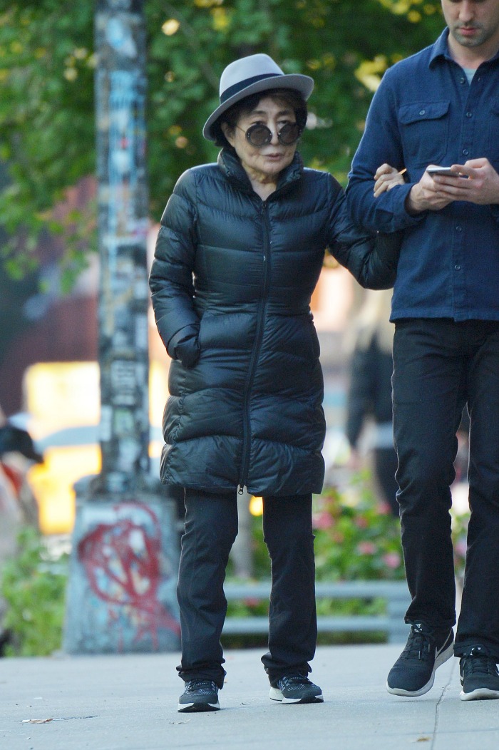 Yoko Ono had a hand as she walked round Lennon's old homes. Source: Getty.