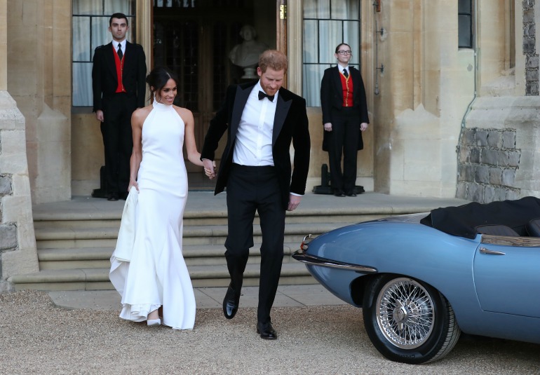 Meghan opted for an elegant figure-skimming full-length gown, while Prince Harry looked dapper in black suit for the evening reception at Frogmore House. Source: Getty 