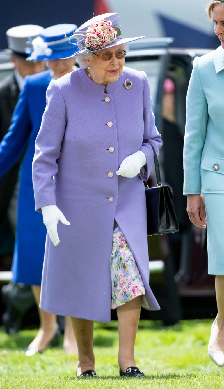 Queen Elizabeth was all smiles looking elegant in a lilac outfit and matching floral hat for the occasion. Source: Getty