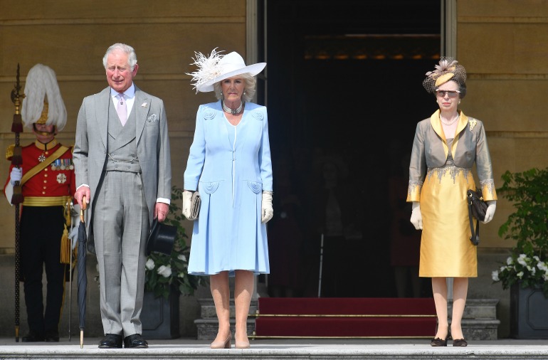 Prince Charles, Camilla and Princess Anne attend a garden party at Buckingham Palace on Tuesday. Source: Getty 