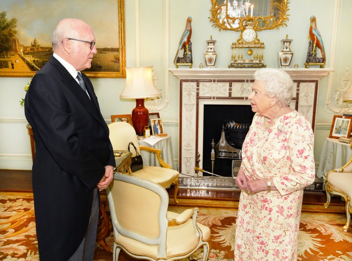 The Queen proudly displayed a photo of Meghan and Harry at Buckingham Palace. 