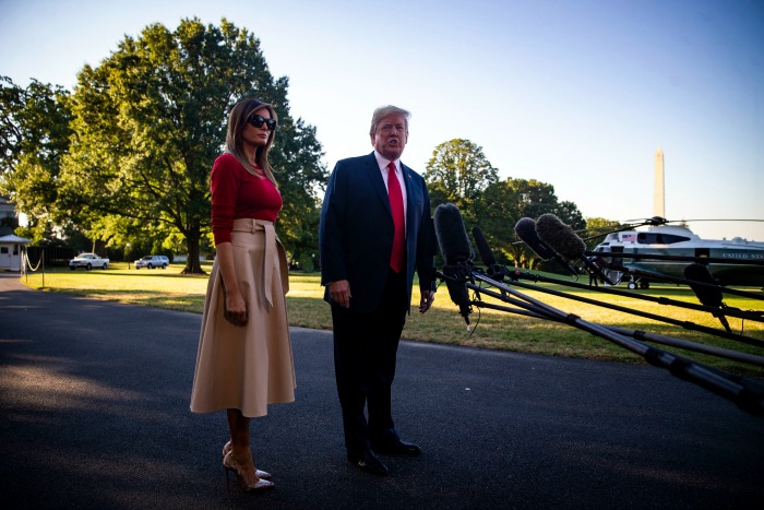 Melania Trump dressed in a stunning beige and red outfit as she left to White House on route to Brussels. Source: Getty 