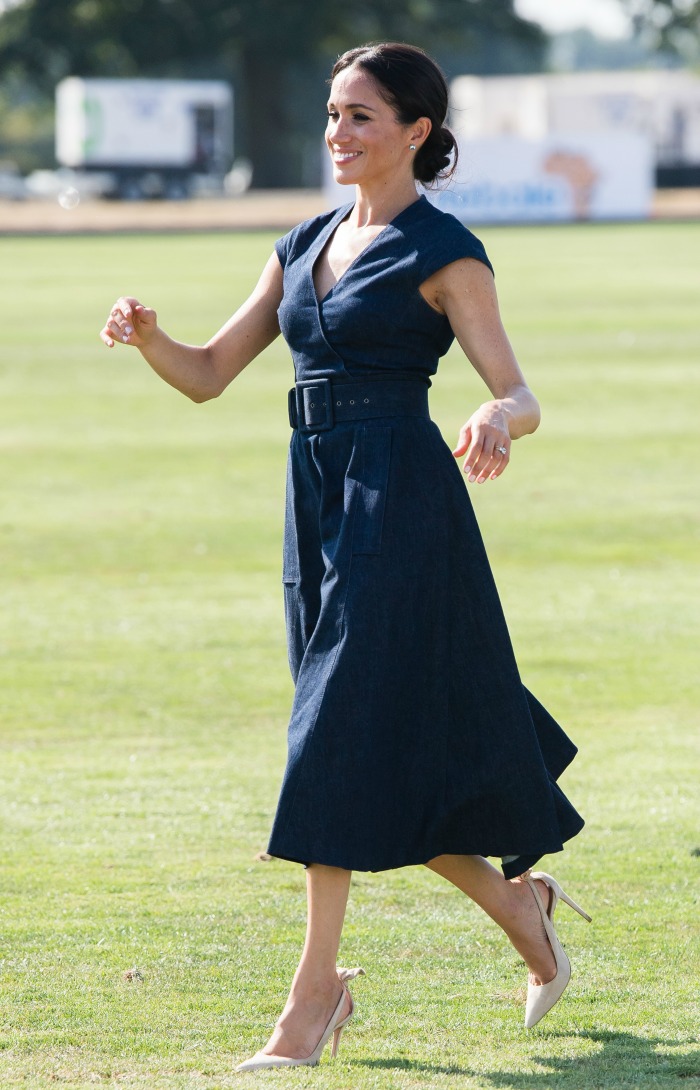Meghan wowed onlookers in a navy Carolina Herrera 