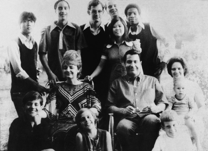 American religious leader Jim Jones and his wife, Marceline Jones seated in front of their adopted children and next to his sister-in-law (right) with her three children. 