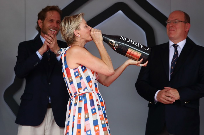 Princess Charlene was all smiles at the Monaco Grand Prix as she downed champagne. 