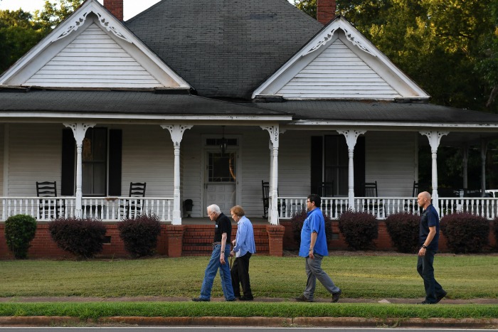 Jimmy Carter walks with his wife in their hometown.