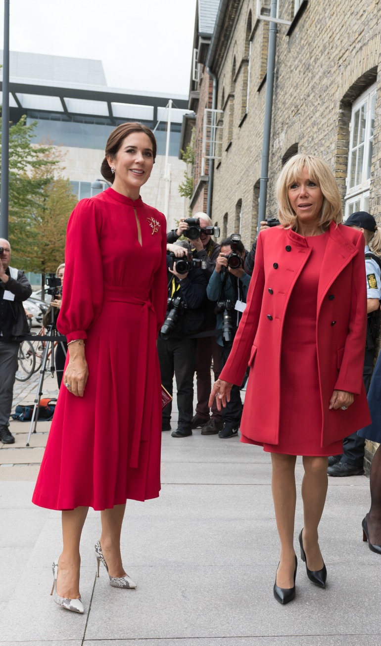 Princess Mary and French First Lady Brigitte Macron both looked glamorous in red during a visit to Copenhagen in August last year. Source: Getty 