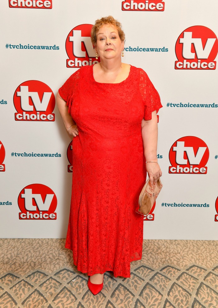 Anne Hegerty looked stunning as she stepped out in a vibrant red dress for the TV Choice Awards in London. 