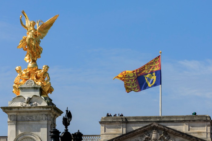Seeing the Royal Standard flag flying above the palace means the Queen is home. Source: Getty.