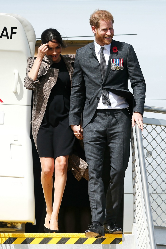 Meghan opted for a shorter black dress for the arrival. Source: Getty.