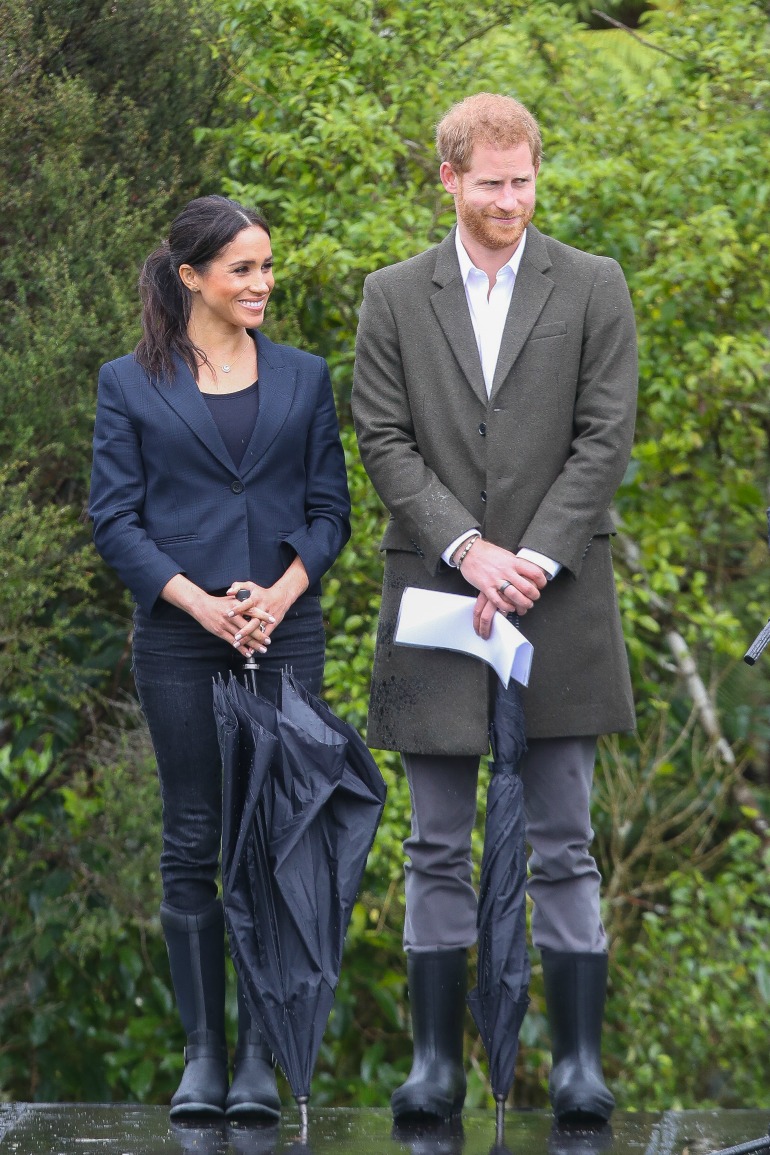 Meghan and Prince Harry braved the heavy downpour as they arrived at Redvale on Auckland's north shore on Tuesday. Source: Getty