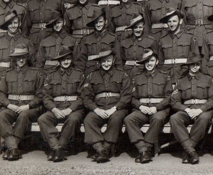 Alan Robinson (front row, second on the right) sits with the anti aircraft battalion in 1942. 