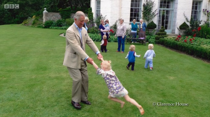 Prince Charles was also seen spinning one of Camilla's grandchildren round. Source: YouTube/S-Rank TV.