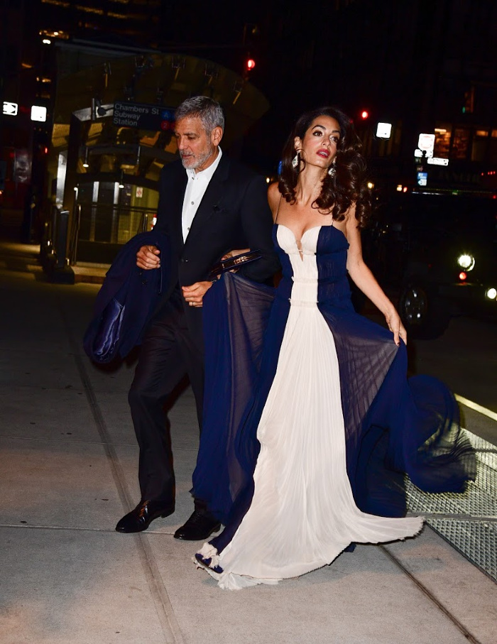 Amal Clooney looked beautiful in a long, flowy gown as she stepped out with husband George Clooney. 