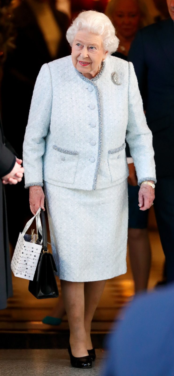 Queen Elizabeth stepped out in a gorgeous winter ensemble to attend a Christmas lunch on Tuesday. Source: Getty