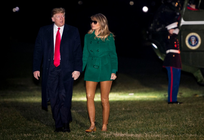 Melania stepped out in a pair of skin coloured tights and a green jacket following a visit to Iraq. 