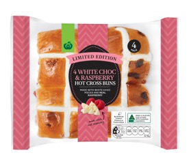 Four pack of white chocolate raspberry hot cross buns, priced at $3.50. Source: Woolworths
