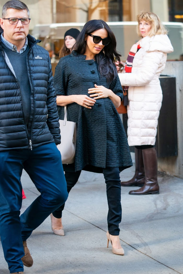 Meghan was seen clutching her baby bump in the Big Apple. Source: Getty.