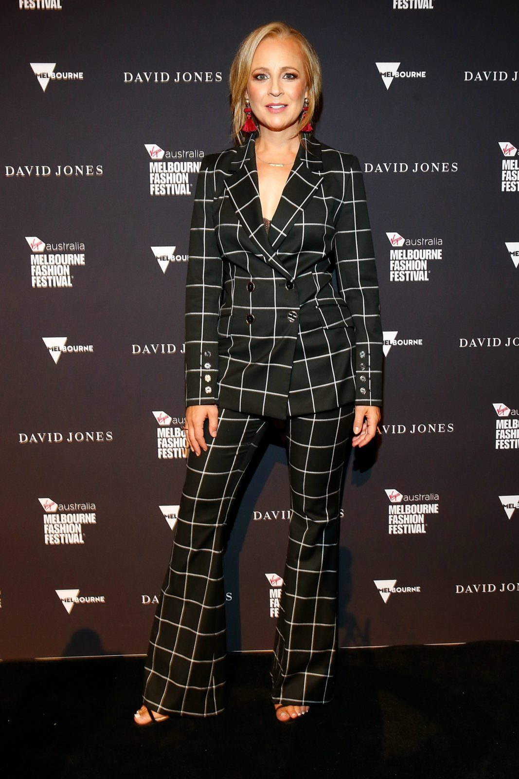 Carrie Bickmore showed off her incredible post-pregnancy figure in a striking pantsuit. Source: Getty