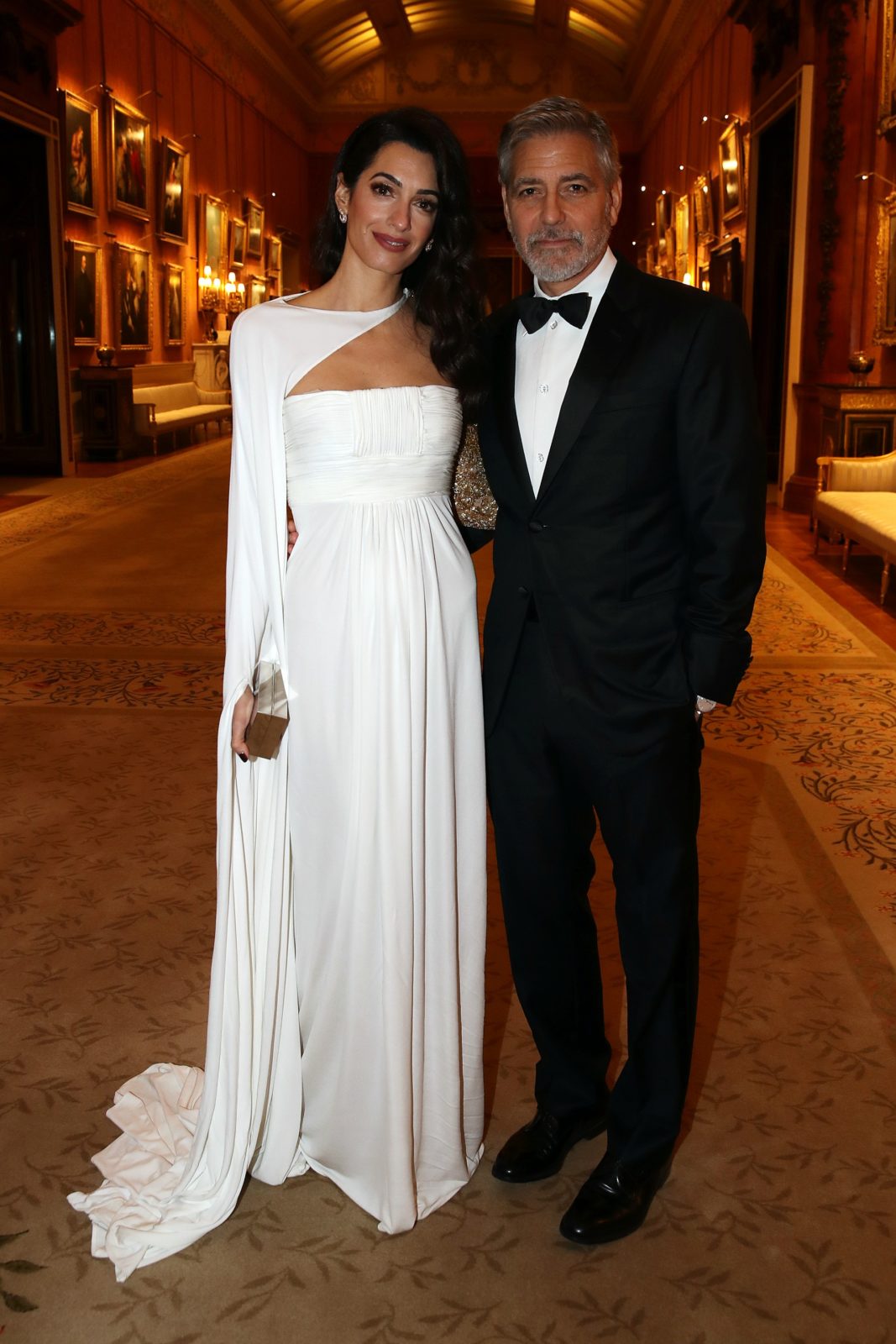 Amal and George Clooney stepped out for a dinner at Buckingham Palace on Tuesday. Source: Getty