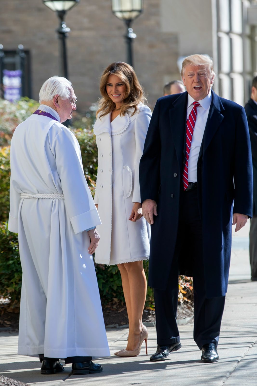 Melania Trump looked stunning in a white coat as she attended a St Patrick's Day church service alongside husband Donald Trump. Source: Getty