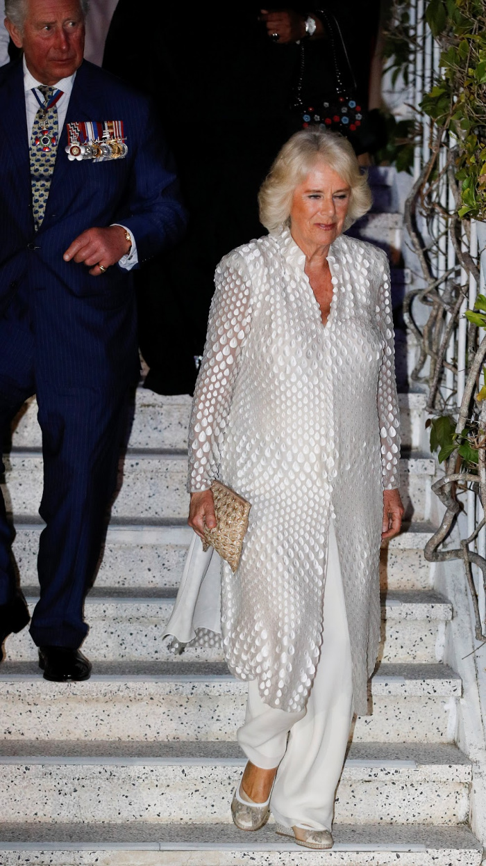 Camilla looked gorgeous in white as she arrived for a reception at the Prime Minister's residence during a Caribbean tour.