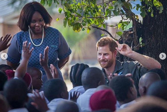 Prince Harry interacts with children during a trip to Botswana in 2017. 