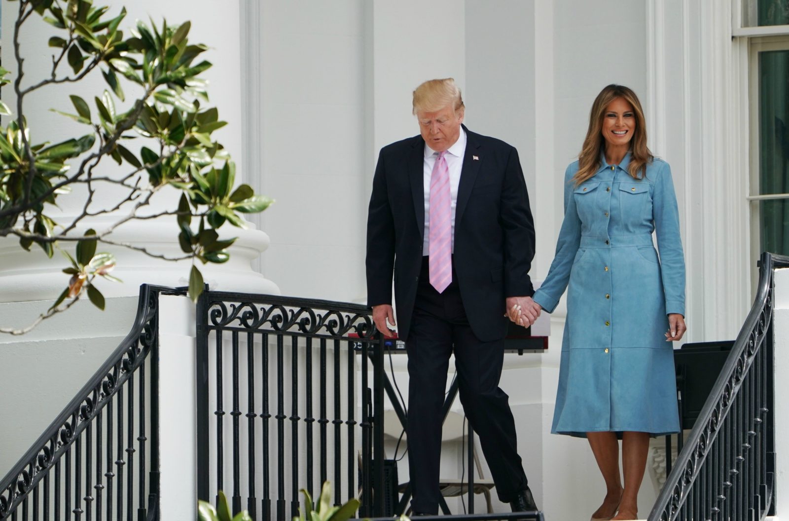 Donald Trump held hands with his wife as they greeted the crowd. Source: Getty.