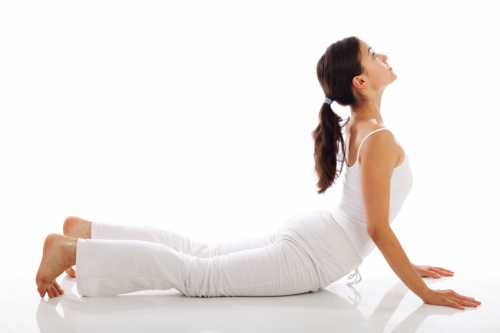 Young woman doing yoga exercise