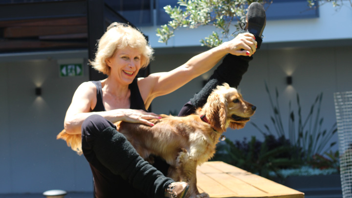 Tracie-O-Keefe-stretching-with-dog-photo-credit-Kathy-Divine